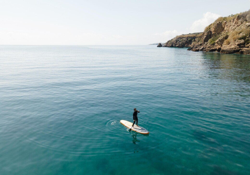 man-surfing-with-beautiful-view