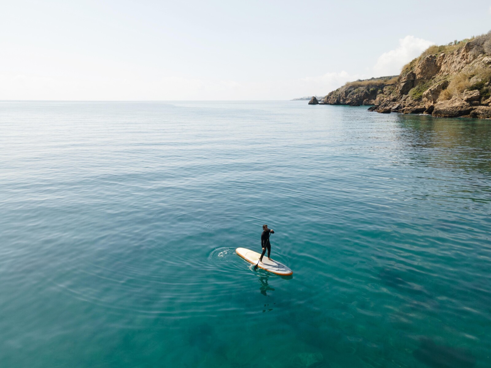 man-surfing-with-beautiful-view